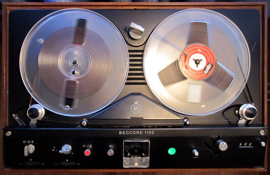 A vintage Beocord 1100 reel-to-reel deck with tape reels loaded
